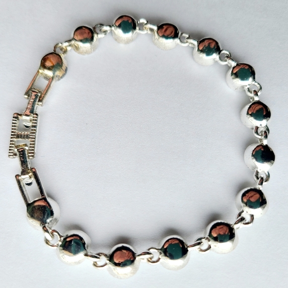 Avon Silvertone and Rhinestone Tennis Bracelet - Picture 2 of 5